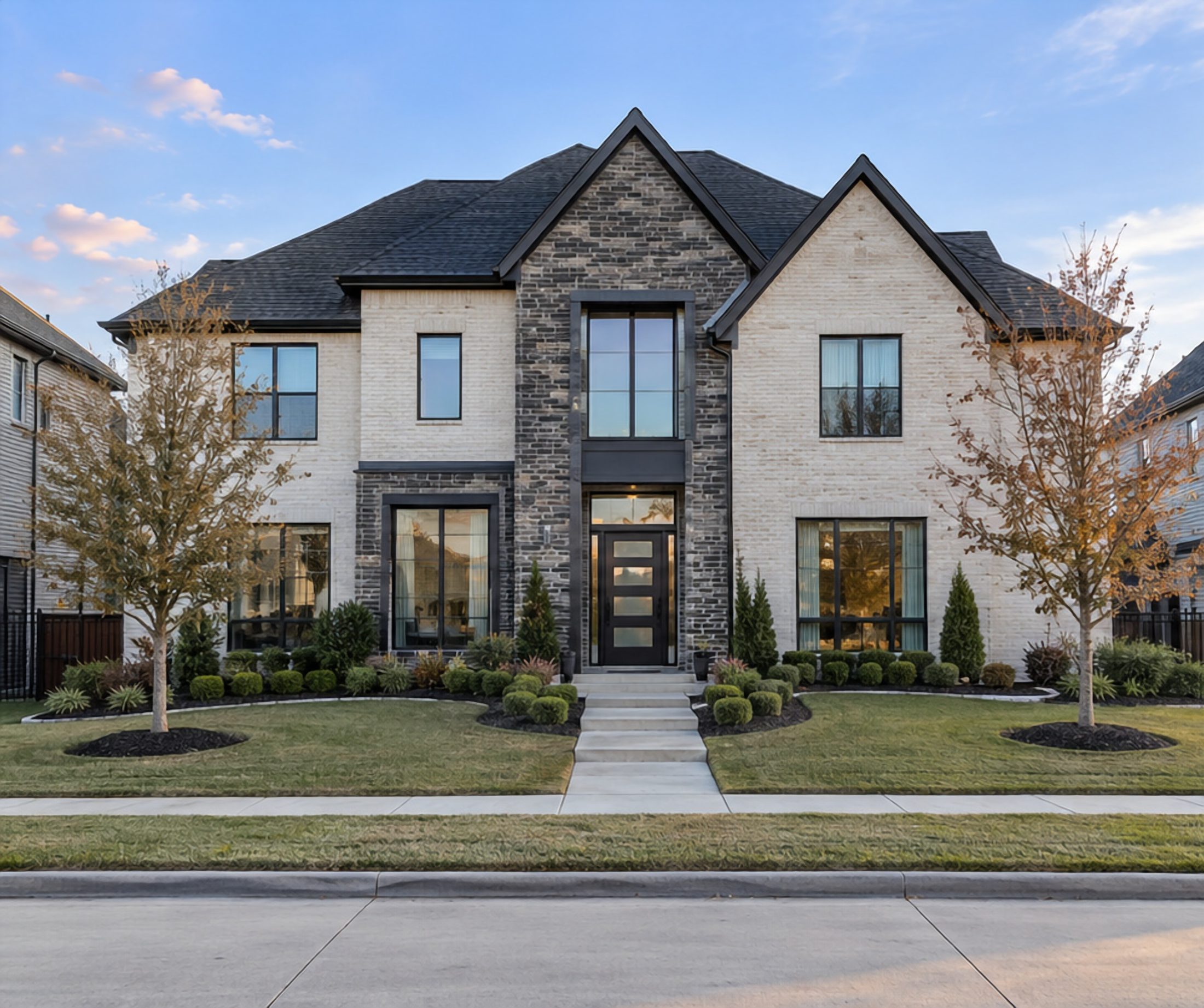 Modern farmhouse with twin gables in daylight, before lighting