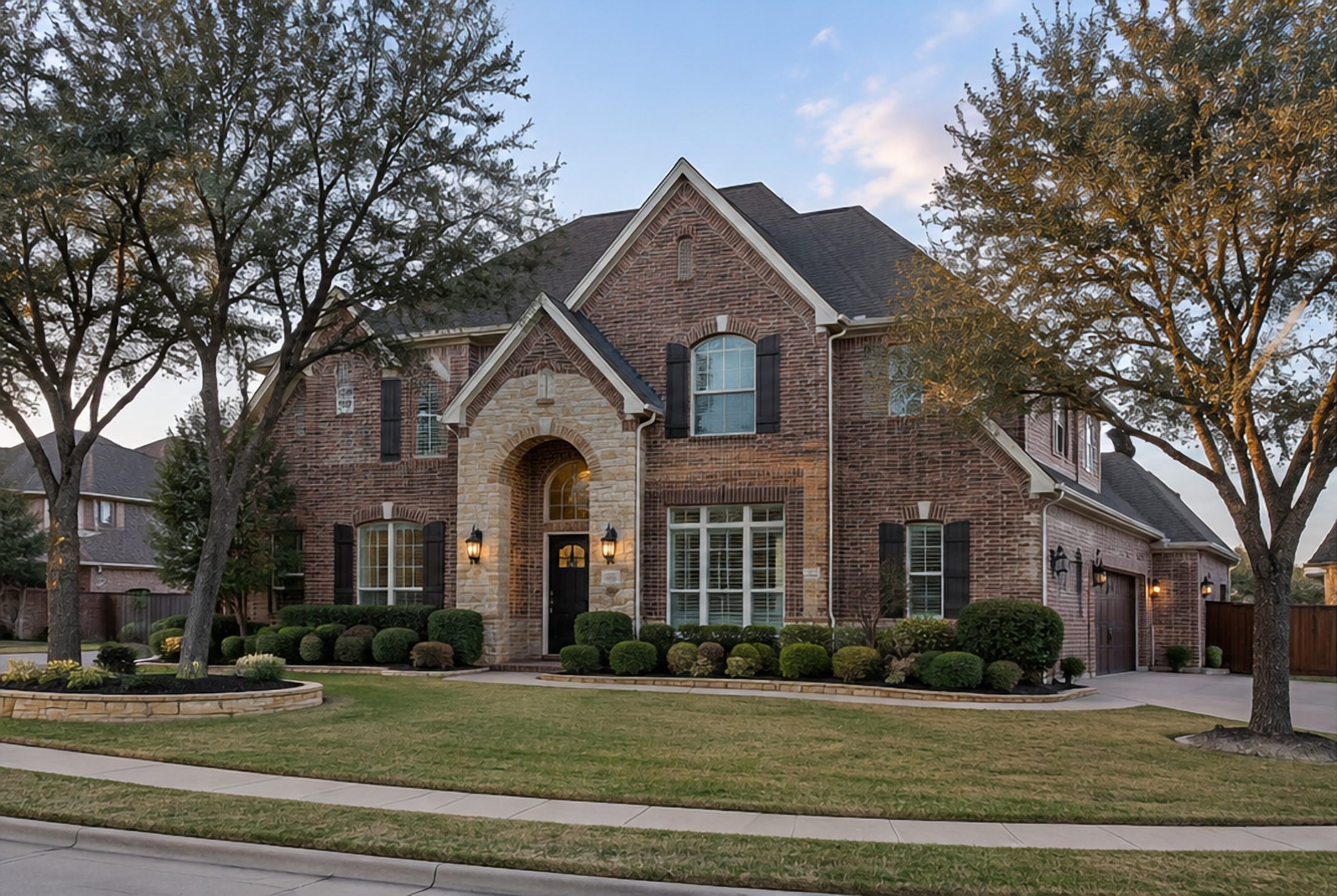 Brick traditional under mature trees in daylight, before lighting
